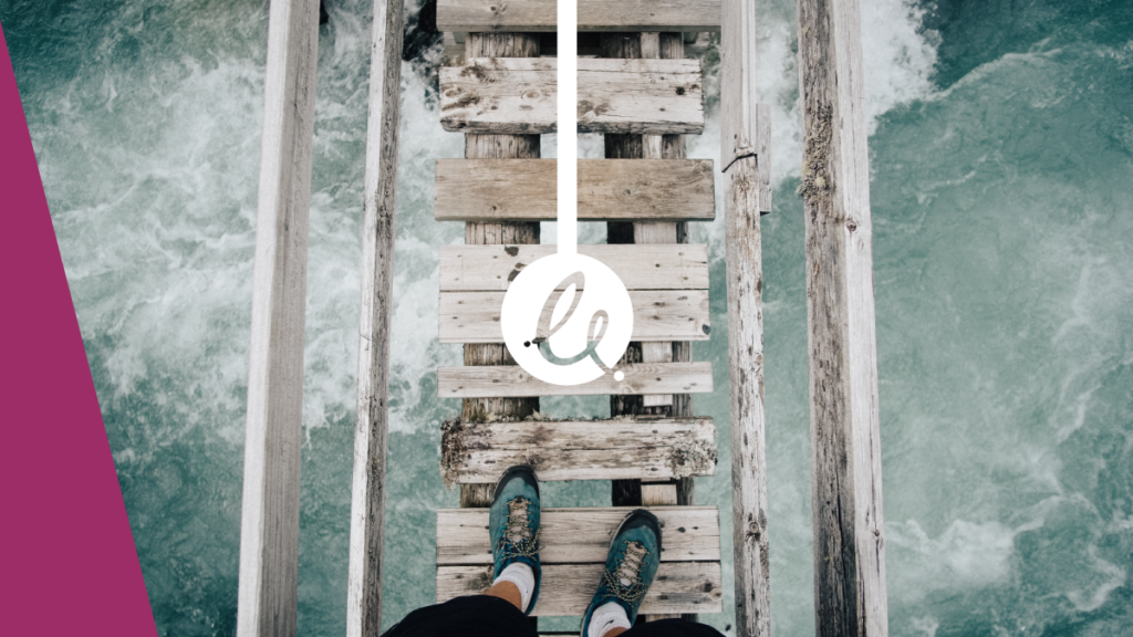 Decorative image - photo looking down on a river through a wooden bridge as someone walks over. in image centre is a Epimorphics swish logo in white with a white line raising to the top of the image. To the far left there is an accented dark purple edge